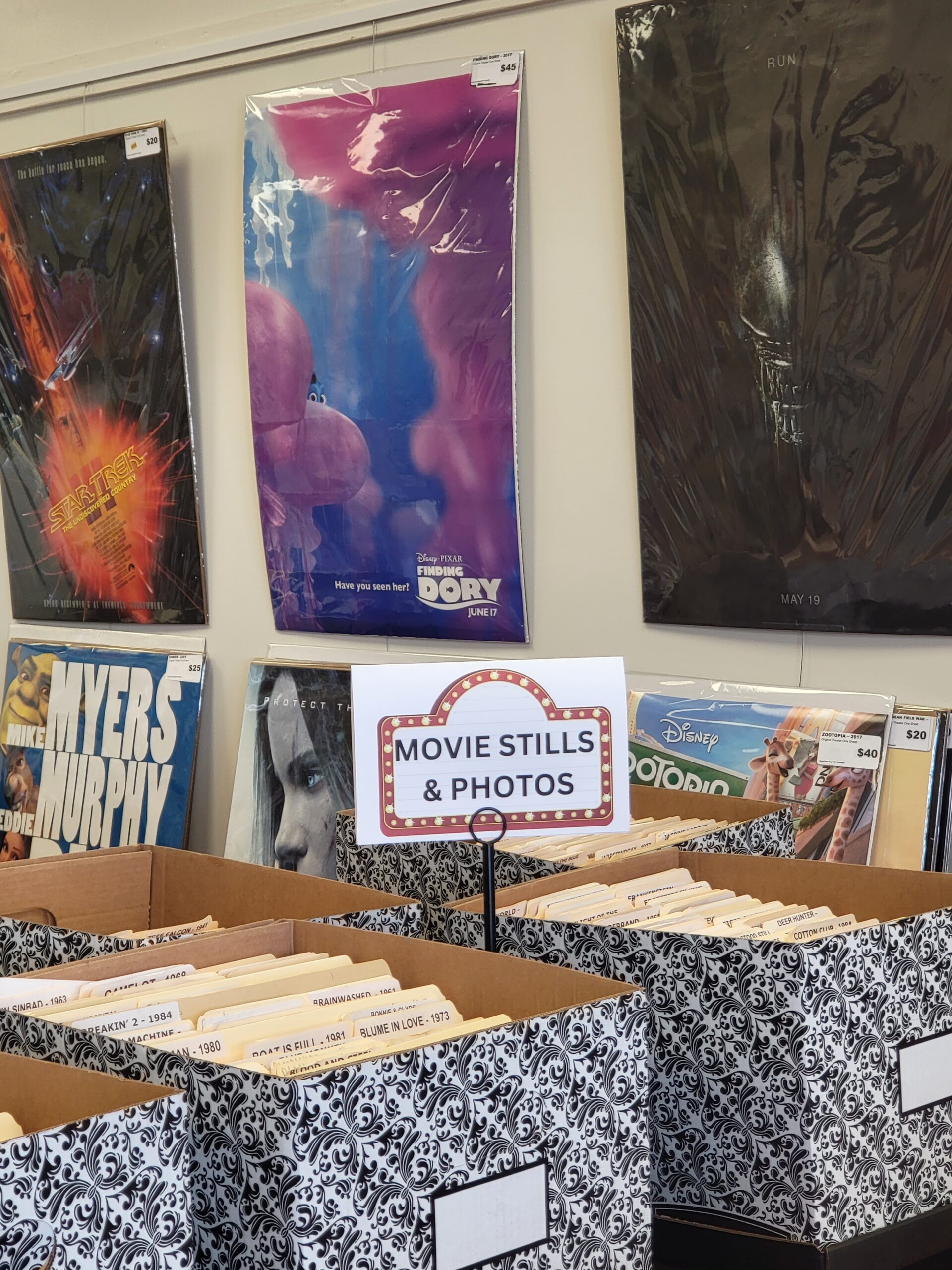 MPA archive material: movie posters in protective sleeves alongside folders of stills and photos.