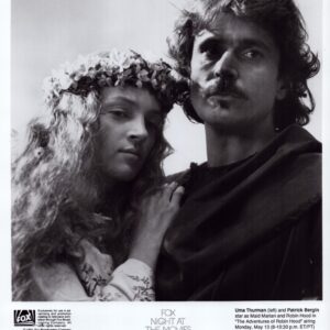 Black-and-white promotional photo of a man and a woman in medieval costumes, the woman wearing a flower crown, standing close together, with the title 'The Adventures of Robin Hood' at the bottom.