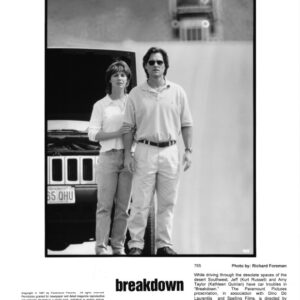 Black-and-white poster for the film Breakdown: a man wearing sunglasses and a woman in a light shirt stand side by side in front of a Jeep, with the movie title and credits at the bottom.