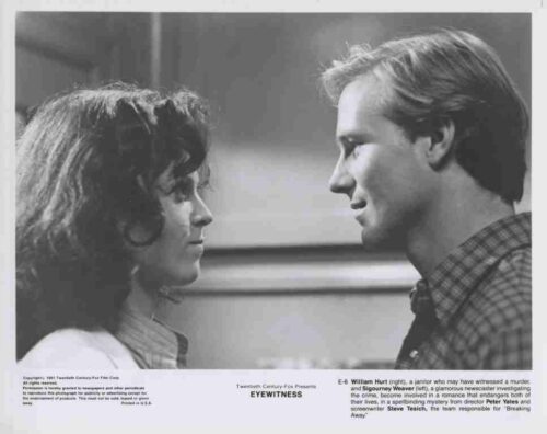 Black-and-white still of a man and woman facing each other in conversation, from the film EyeWitness.