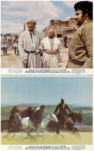 Top frame shows men in traditional robes in a desert village with ruined buildings; foreground figures gaze outward.
