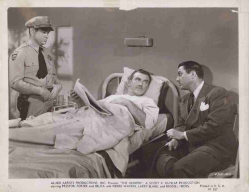 Hospital room scene from a 1940s film: a man in bed reads a newspaper while a uniformed officer stands nearby and a suited man sits beside him.