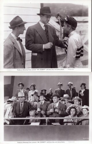 Three men in 1940s attire on a film set; one man adjusts another's tie as a third watches nearby.
