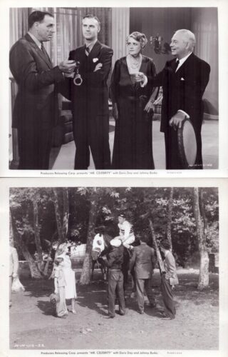 Four formally dressed people on a film set; one man holds handcuffs as others watch.