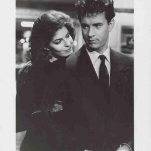 Film poster for 'Nothing in Common' featuring a man in a suit looking to the side while a woman rests her head on his shoulder in a black-and-white image.