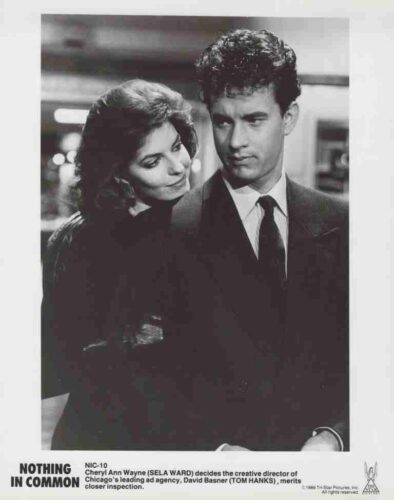 Film poster for 'Nothing in Common' featuring a man in a suit looking to the side while a woman rests her head on his shoulder in a black-and-white image.