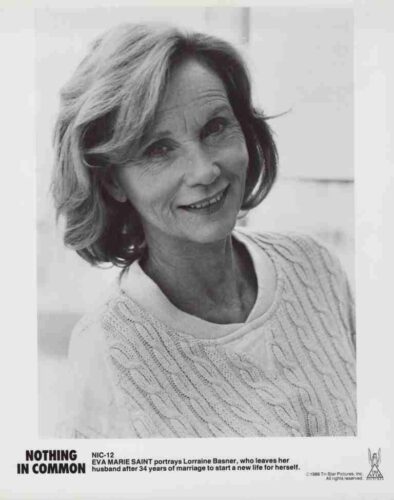 Promotional still for Nothing in Common: a smiling woman in a knit sweater; Lorraine Basner starts a new life.
