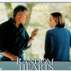 Movie poster: man in dark shirt and woman in a blue sweater face each other; 'Random Hearts' title across bottom.