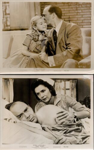 A tender moment: a man leans in to kiss a young girl on the forehead as they sit on a bench, sepia-toned still from a vintage film.