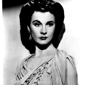 Black-and-white film poster of a woman in an elegant draped gown and earrings, with 'That Hamilton Woman' at the bottom.