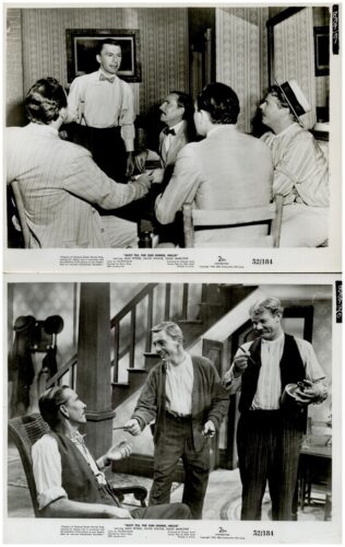 Two vintage film stills: top shows five men in 1930s attire around a table in a wallpapered room, one standing and speaking; bottom shows three men in a parlor, two standing and one seated, jokingly passing items.