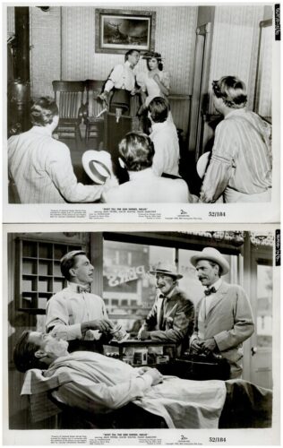 Two black-and-white film stills: top scene with a man and woman in period dress addressing a seated audience in a decorated room; bottom scene shows a man getting shaved while two others observe near a storefront.