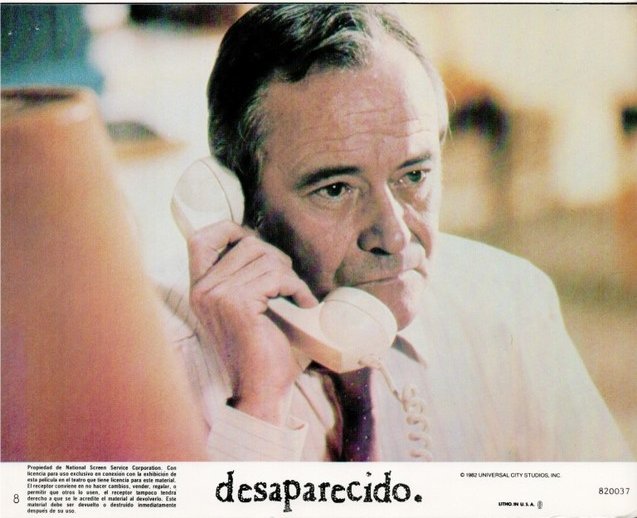 Older man on a landline phone, looking worried, as part of a poster for Desaparecido.