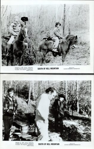 Two men on horseback ride through a leafless forest in a black-and-white film still labeled 'South of Hell Mountain'.