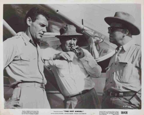 Black-and-white photo of three men in 1940s-style outfits by a propeller plane; the center man lights a cigarette while the other two watch.
