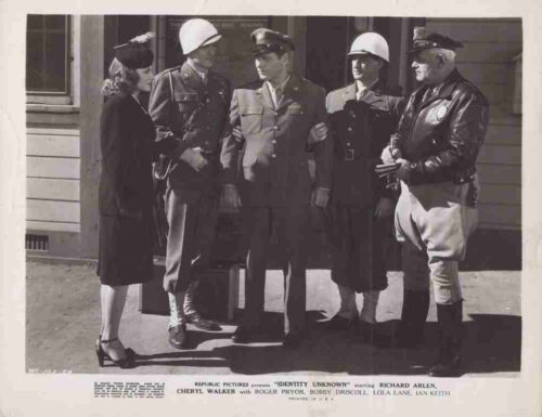 Vintage black-and-white still showing five people in 1940s military uniforms and civilian attire standing outside a building.